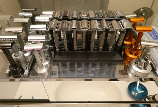 Collection of safety razors displayed in a rack.
