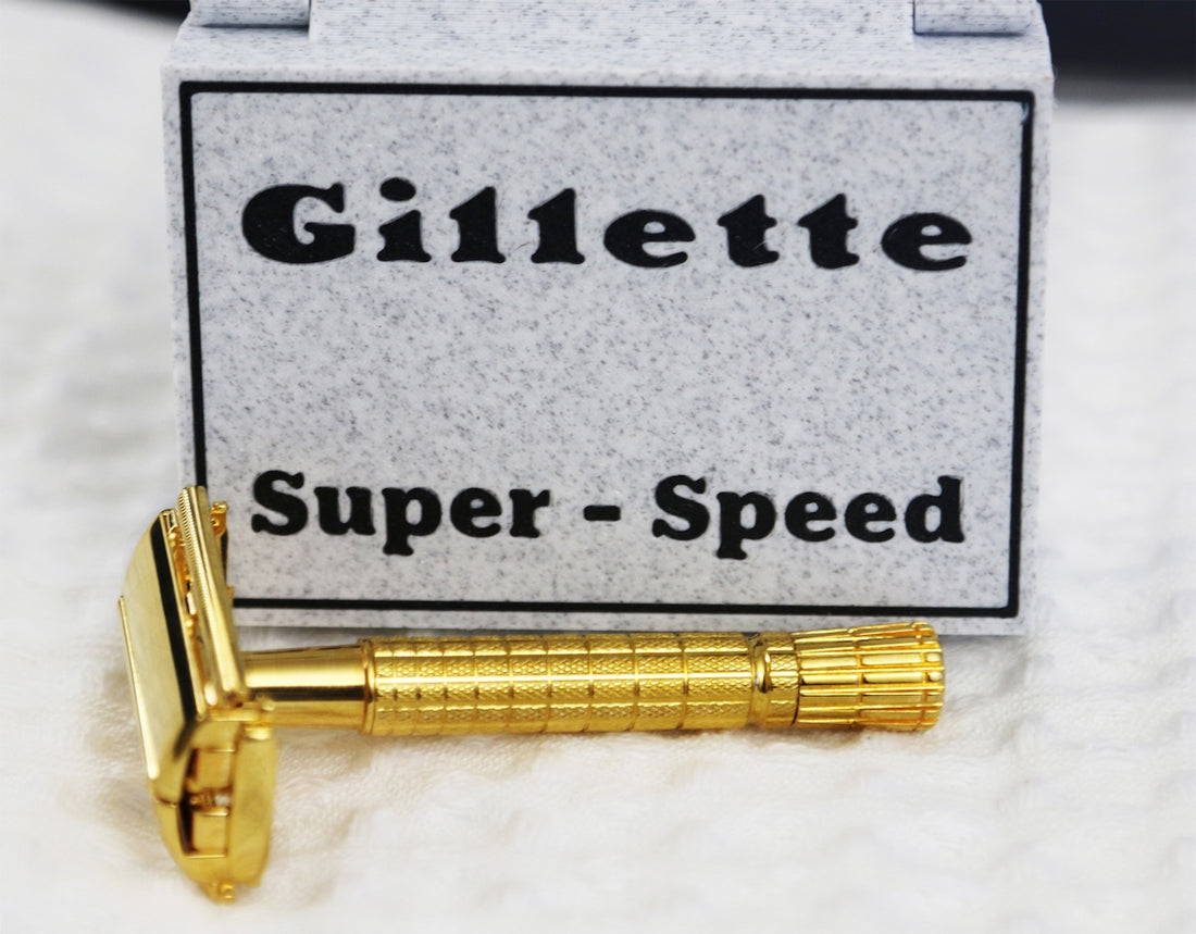 A gold gillette super-speed razor with its box.