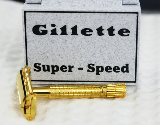A gold gillette super-speed razor with its box