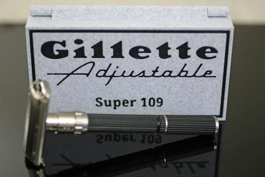 A gillette adjustable super 109 razor with its case.
